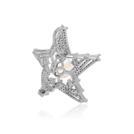 Angled view of the star pearl brooch, highlighting the shimmer of the cubic zirconia.