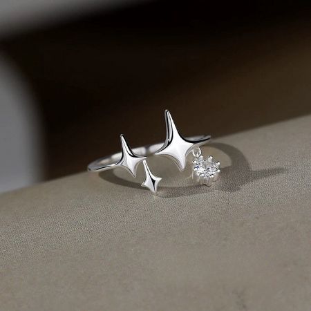 A minimalist 925 sterling silver star ring with a side gemstone accent.