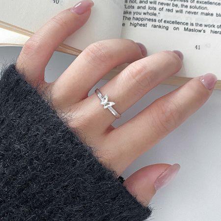 A model wearing the minimalist 925 silver butterfly ring, showcasing its elegant and adjustable fit for everyday wear.
