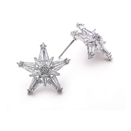 Detailed view of the star-shaped stud earrings, highlighting the arrangement of clear gemstones.