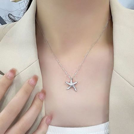 Full view of the sterling silver starfish necklace, showcasing its delicate chain and pendant.
