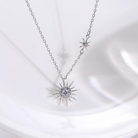 The starburst necklace displayed as part of a matching jewelry set with earrings.