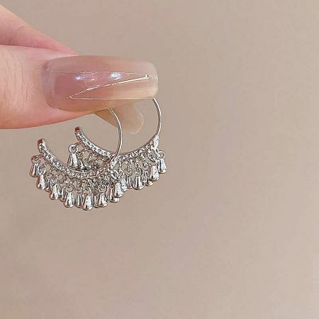 Full pair of the unique crescent and tassel design silver earrings.