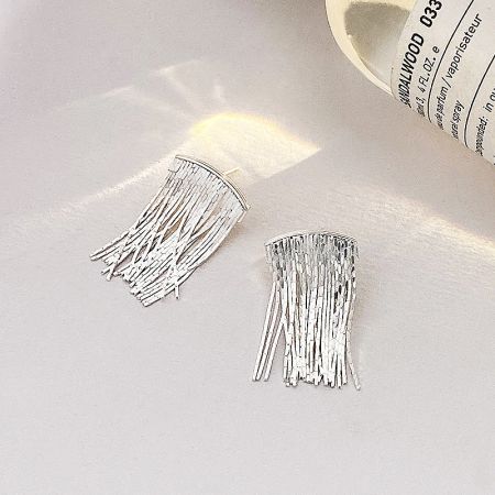 A detailed close-up of the S925 sterling silver waterfall tassel earrings in a silver finish.