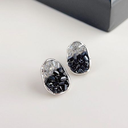 A pair of oval stud earrings featuring a beautiful mix of black and clear crystals.
