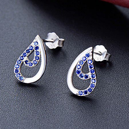 Detailed view of the sterling silver water drop earrings with serene blue cubic zirconia.