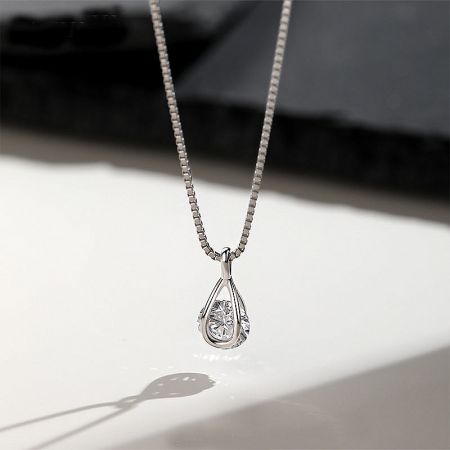 925 Sterling Silver Teardrop Cubic Zirconia Pendant Necklace - A high-quality studio shot of a 925 sterling silver necklace featuring an elegant teardrop pendant with a single, brilliant cubic zirconia stone.