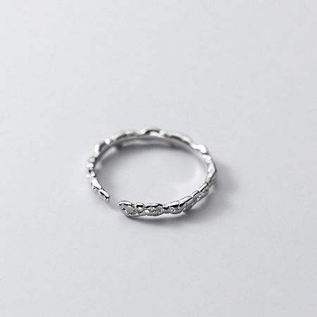 Top-down view of the silver braided ring, emphasizing its intricate woven pattern.