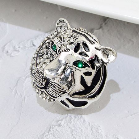 Luxury Crystal Rhinestone Silver Tiger Head Brooch (Set of 5) - A detailed close-up of a luxury silver-plated tiger head brooch, intricately decorated with sparkling clear rhinestones and striking green gemstone eyes.