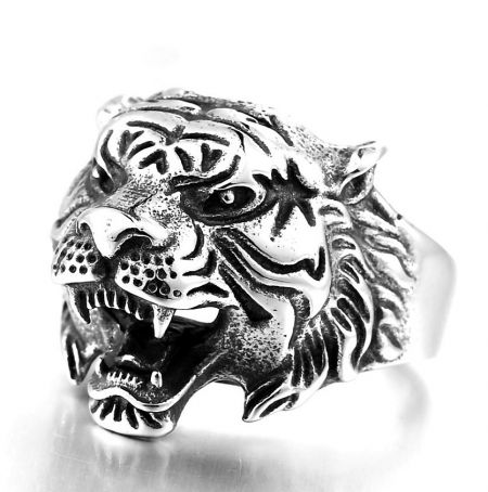 Side view of the silver tiger head ring, highlighting the textured fur and sharp teeth details.