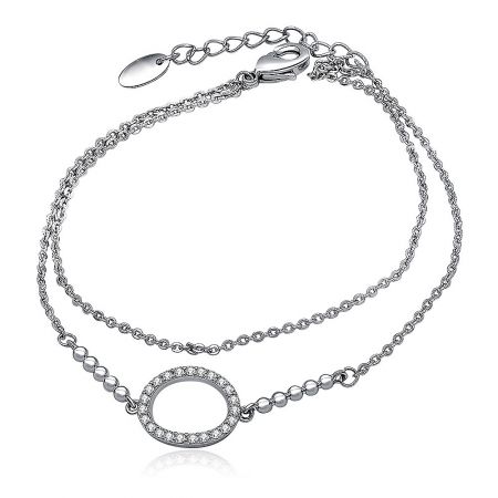 CZ Oval Charm Link Layered Bracelet - The CZ Oval Charm Link Layered Bracelet displayed on a white background, highlighting its double-chain design and the central circular pendant set with brilliant cubic zirconia stones.
