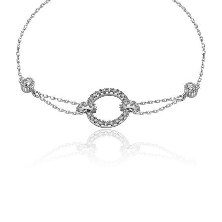 Detailed view of the silver-toned bracelet's central circular pendant and double-chain design.