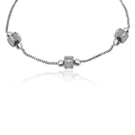 Detailed view of the bracelet's chain and cubic zirconia charms, highlighting the craftsmanship.