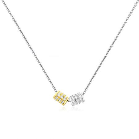 Two Tone Geometry Necklace - Close-up of the Two-Tone Geometry Necklace, showcasing its dual gold and silver pendants set with sparkling white cubic zirconia stones against a white background.
