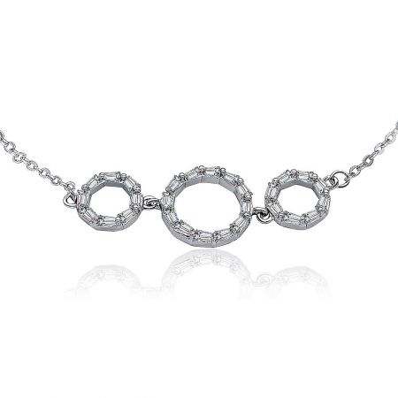 A matching silver-toned necklace with three circular pendants, illustrating the collection's design.