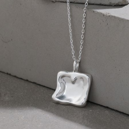 The 925 sterling silver version of the square charm necklace, showcasing its clean lines and polished surface.