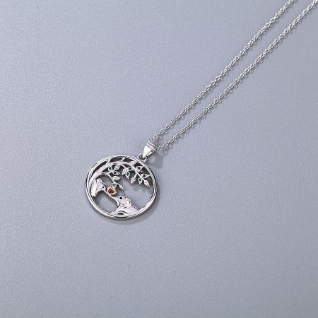 The mother and daughter elephant necklace set displayed on a neutral background.
