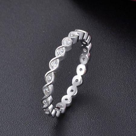 A single 925 silver twist ring with cubic zirconia, highlighting the intricate band design.