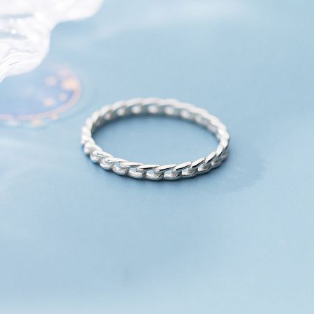 Close-up of a polished 925 sterling silver ring with a classic twist design.
