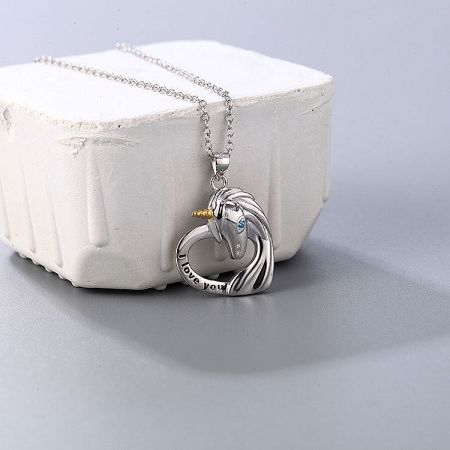 925 Sterling Silver Unicorn Pendant Necklace Set of 5 - A close-up of the 925 sterling silver unicorn pendant necklace, featuring a delicate unicorn charm resting on a heart-shaped base engraved with 'I love you'.