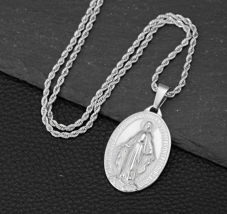 Detailed view of the silver Virgin Mary pendant on a matching chain.