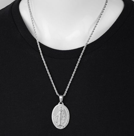 Close-up of the custom silver Mother of God necklace, highlighting the intricate design.