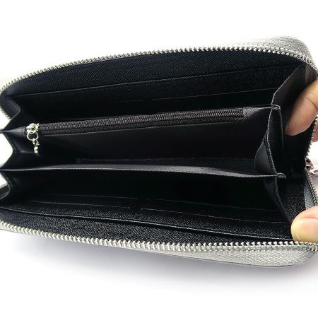 Detailed view of the wallet's interior organization, including card holders and zippered pocket.