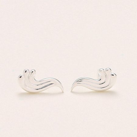 A pair of sterling silver stud earrings featuring a unique, abstract wavy design.