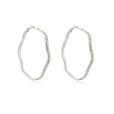 Detailed view of the wavy edge and crystal setting on the Rhodium Hoop Earrings.