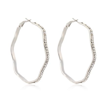Close-up view of the silver wavy hoop earring showcasing the embedded white Czech crystal stones.