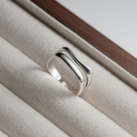 A clear product shot of the adjustable 925 sterling silver wave ring.