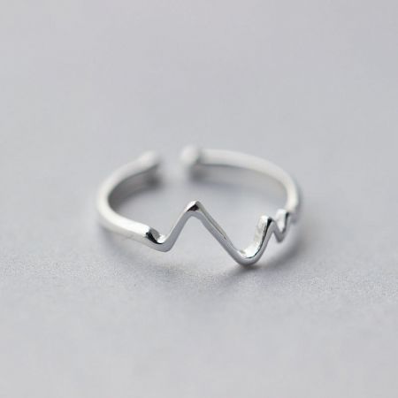 925 Sterling Silver Women's Adjustable Heartbeat Ring Set of 5 - A close-up of a 925 sterling silver adjustable ring featuring a unique wavy heartbeat design, resting on a neutral surface.