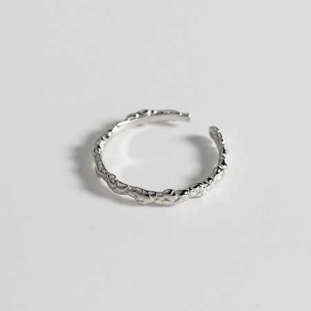 Side profile of the silver braided ring, showing the depth of the woven design.