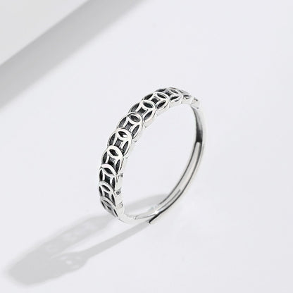 Close-up of a silver ring with a unique woven pattern, part of the adjustable ring set.