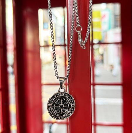 Example of a custom zodiac-themed pendant necklace in silver.