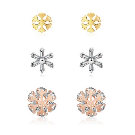 Three Tone CZ Studded Snowflake Earring Set - A set of three pairs of snowflake stud earrings in gold, silver, and rose gold finishes, each studded with sparkling cubic zirconia stones.