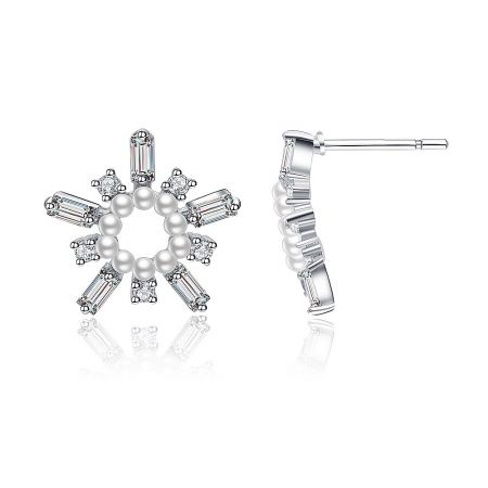 A pair of White As Snow Pearl Earrings displayed to show their snowflake shape and rhodium-plated finish.