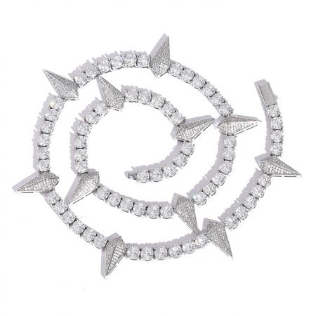 Detailed view of a custom spiral-shaped hip hop jewelry piece with pave-set cubic zirconia.