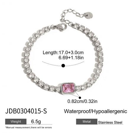 A detailed close-up of the stainless steel tennis bracelet, highlighting the brilliant pink centerpiece stone and quality craftsmanship.