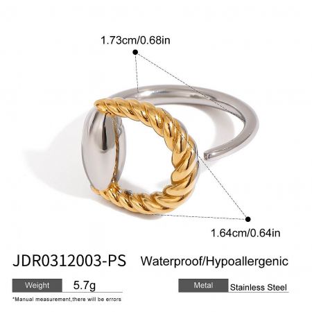 Detailed product shot of a single twisted stainless steel ring with gold accents.