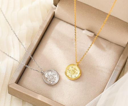 The 925 Sterling Silver Compass Necklace shown in both available silver and gold plating options.