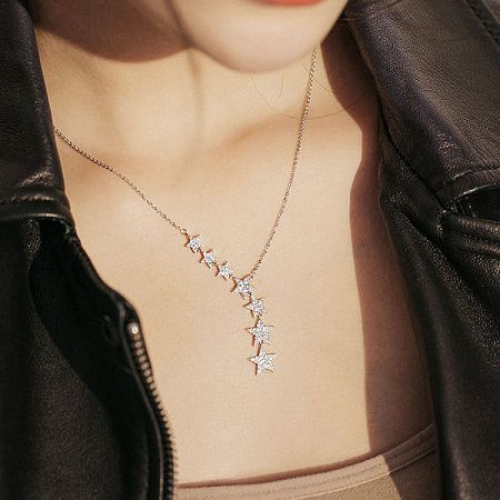Close-up of a star pendant, showing the intricate crystal or diamond detailing.
