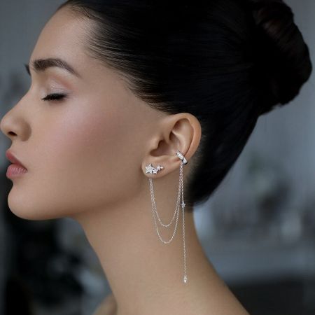 Elegant showcase of the 925 silver star ear cuff with dangling tassel chains.