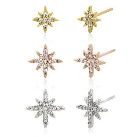 A close-up view of the star-shaped stud earrings in gold, rose gold, and silver, each with a central gemstone accent.