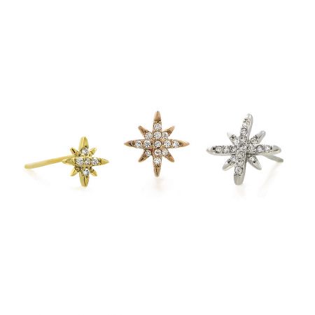 The complete set of three star-shaped earrings, showing the different metal finishes and diamond-like embellishments.