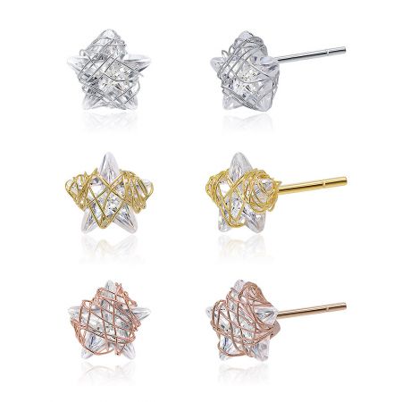 Top-down view of the gold, silver, and rose gold star-shaped earring set.