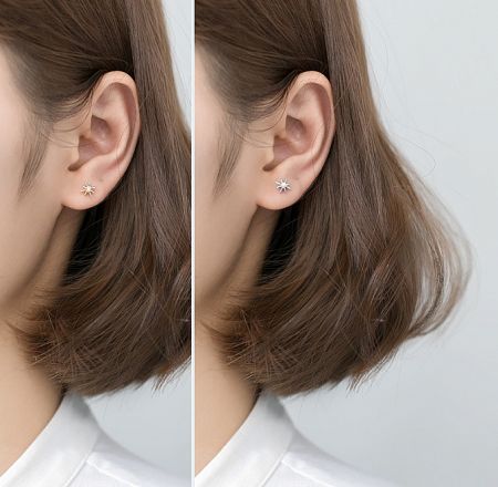 Model showcasing the elegant 925 Sterling Silver Starburst Earring on-ear.