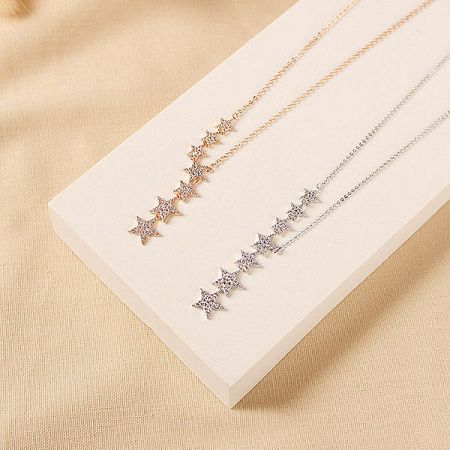 Comparison of the star pendant necklaces in both gold and silver tones.