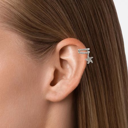 Model wearing the starfish no-piercing ear cuff to demonstrate its fit on the mid-ear.