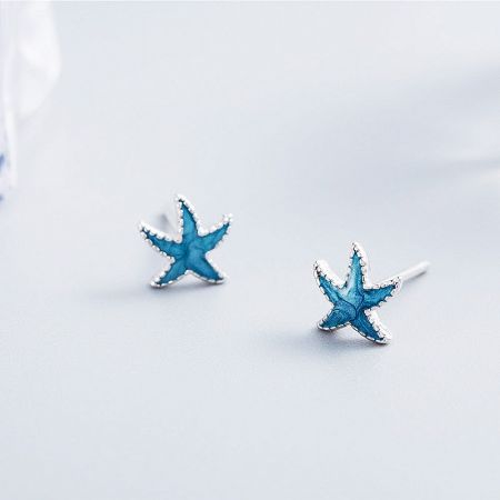 925 Sterling Silver Ocean Sea Tiny Blue Enamel Starfish Stud Earrings (5 pairs) - A pair of 925 sterling silver starfish stud earrings with vibrant blue enamel detailing, shown on a clean white background.